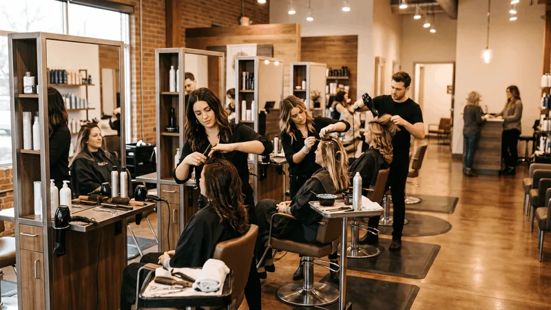 Salon floor with multiple independent styling stations, each with its own client